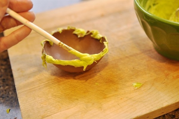 painting chocolate bowls with melted green candy melts