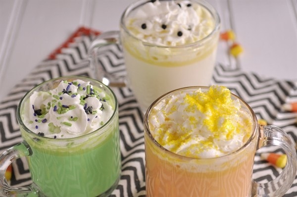 three glass mugs of halloween hot chocolate