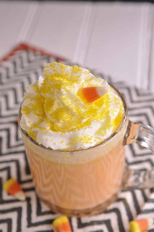 orange hot chocolate whipped cream yellow sprinkles and candy corn