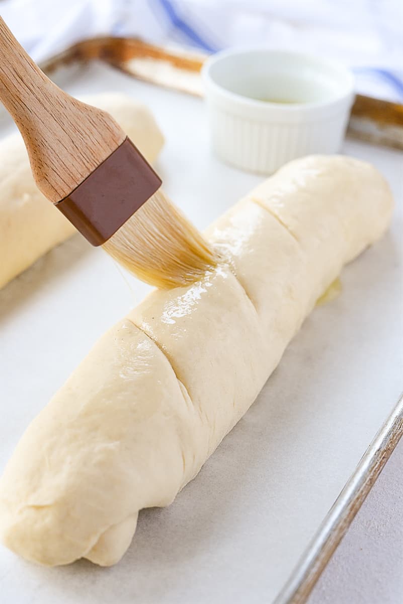 brushing bread with an egg wash