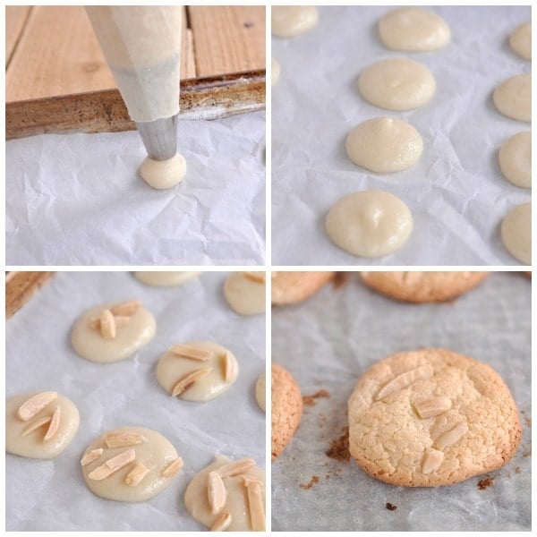 piping almond cookies onto parchment paper