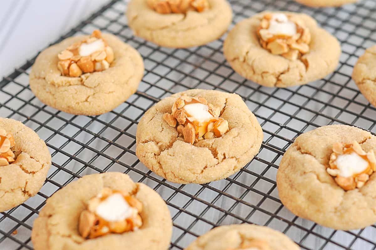 overhead shot of peanut butter blossom cookies on a rack