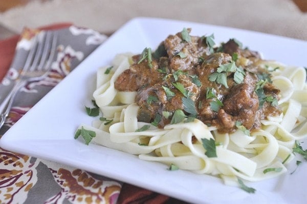 plate of noodles topped with chicken paprikash