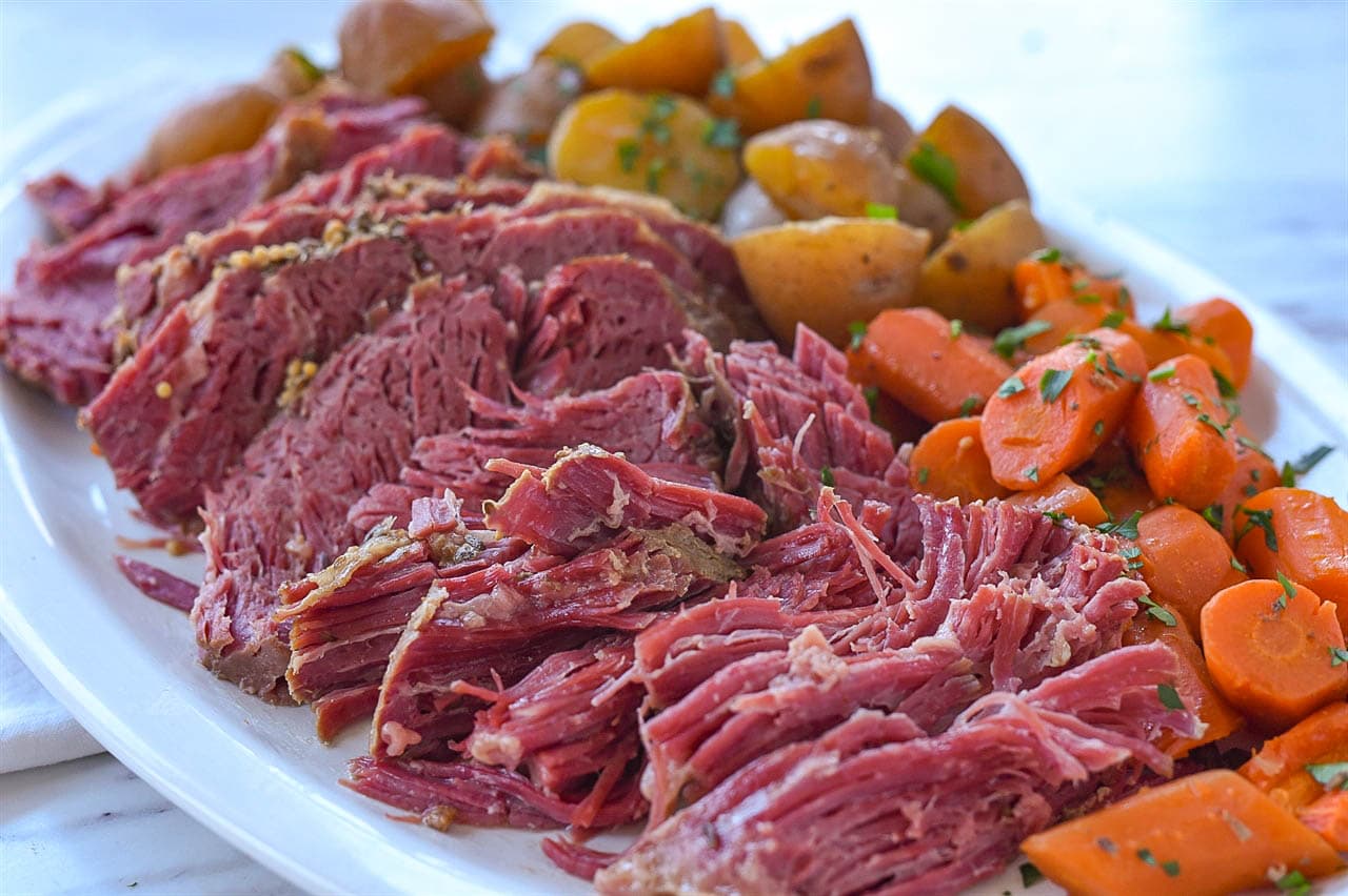 corned beef with carrots and potatoes on a plate