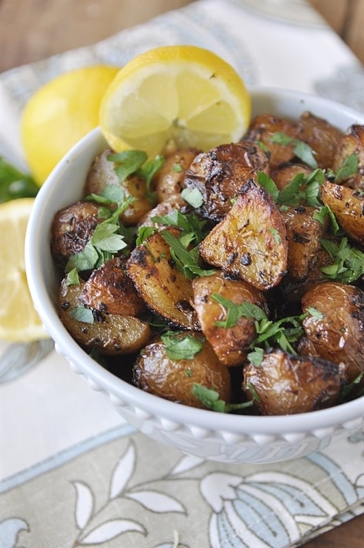 dish of herb roasted potatoes with lemon and parsley