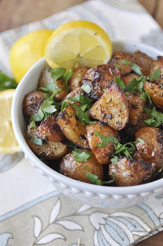 dish of herb roasted potatoes with lemon and parsley