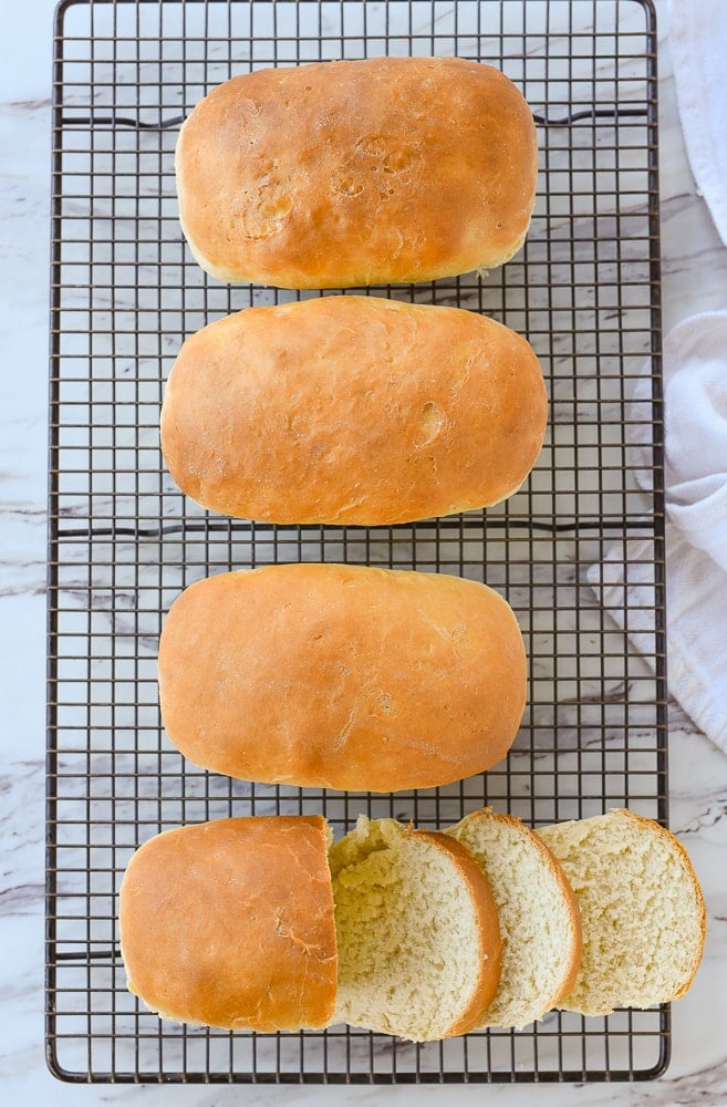 overhead shot of four loaves of bread