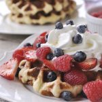 waffle with berries on a palte.