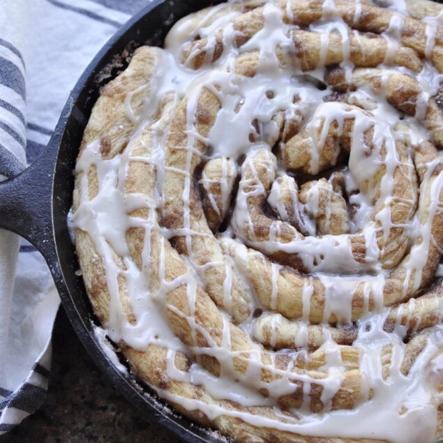 cinnamon roll in cast iron pan