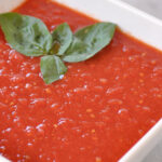 white bowl full of tomato sauce