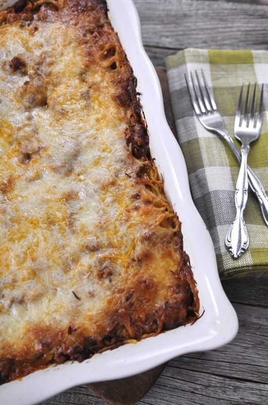 Baked Spaghetti in a white casserole dish