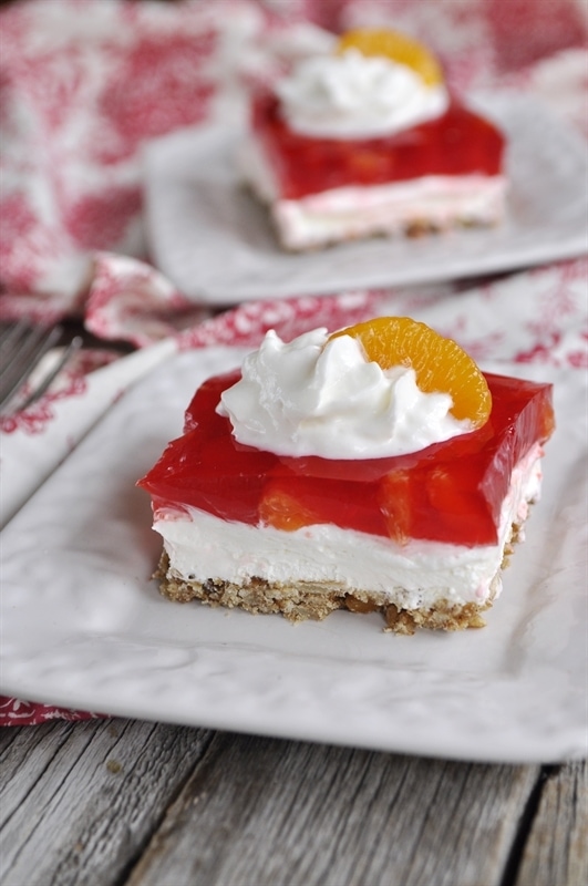 Orange Cranberry Pretzel Salad served on white plates