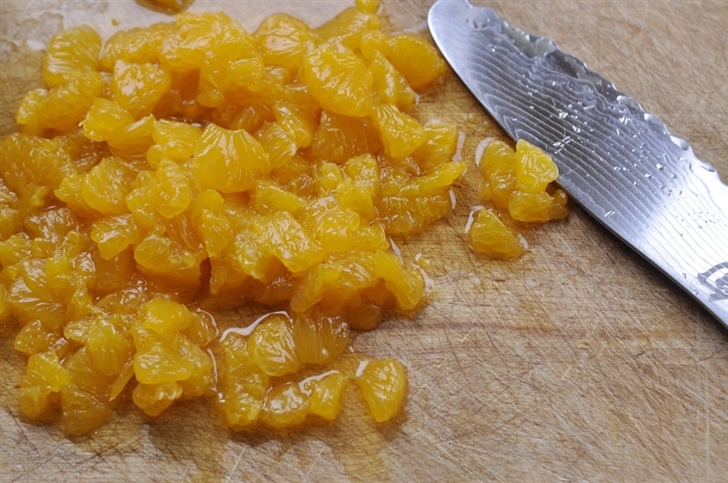 diced mandarin oranges on a cutting board