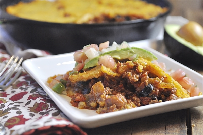 tamale pie casserole topped with avacado