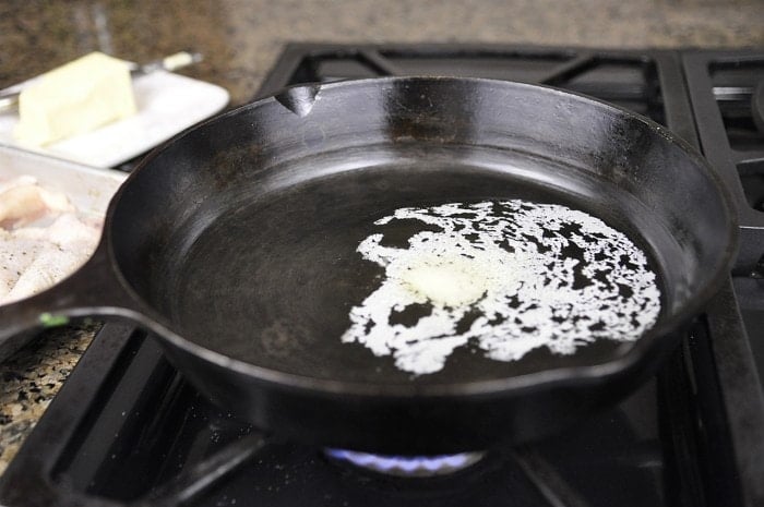 cast iron skillet with melted butter