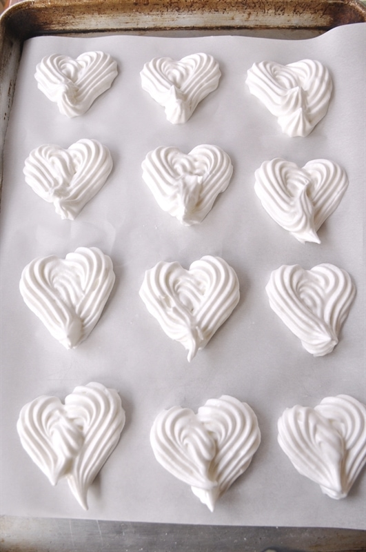 Meringue Hearts on a baking sheet