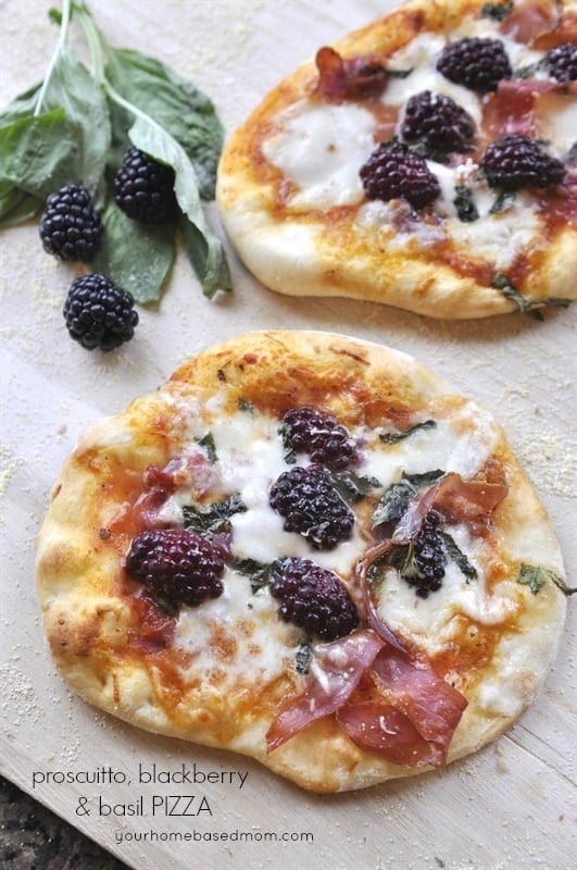 Prosciutto pizza with basil and blackberries