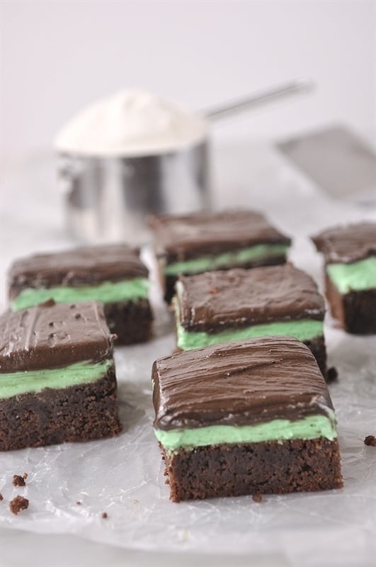 chocolate brownies with mint frosting covered in chocolate