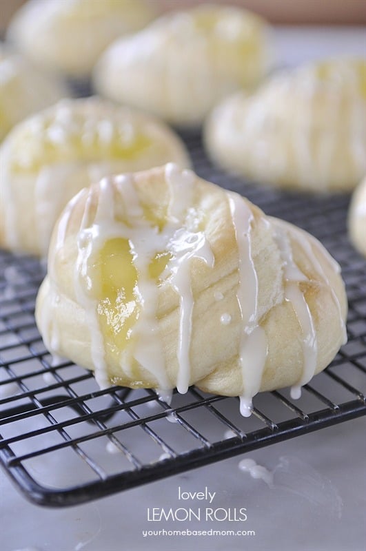 Lemon Curd Rolls with Lemon Drizzle on a baking rack