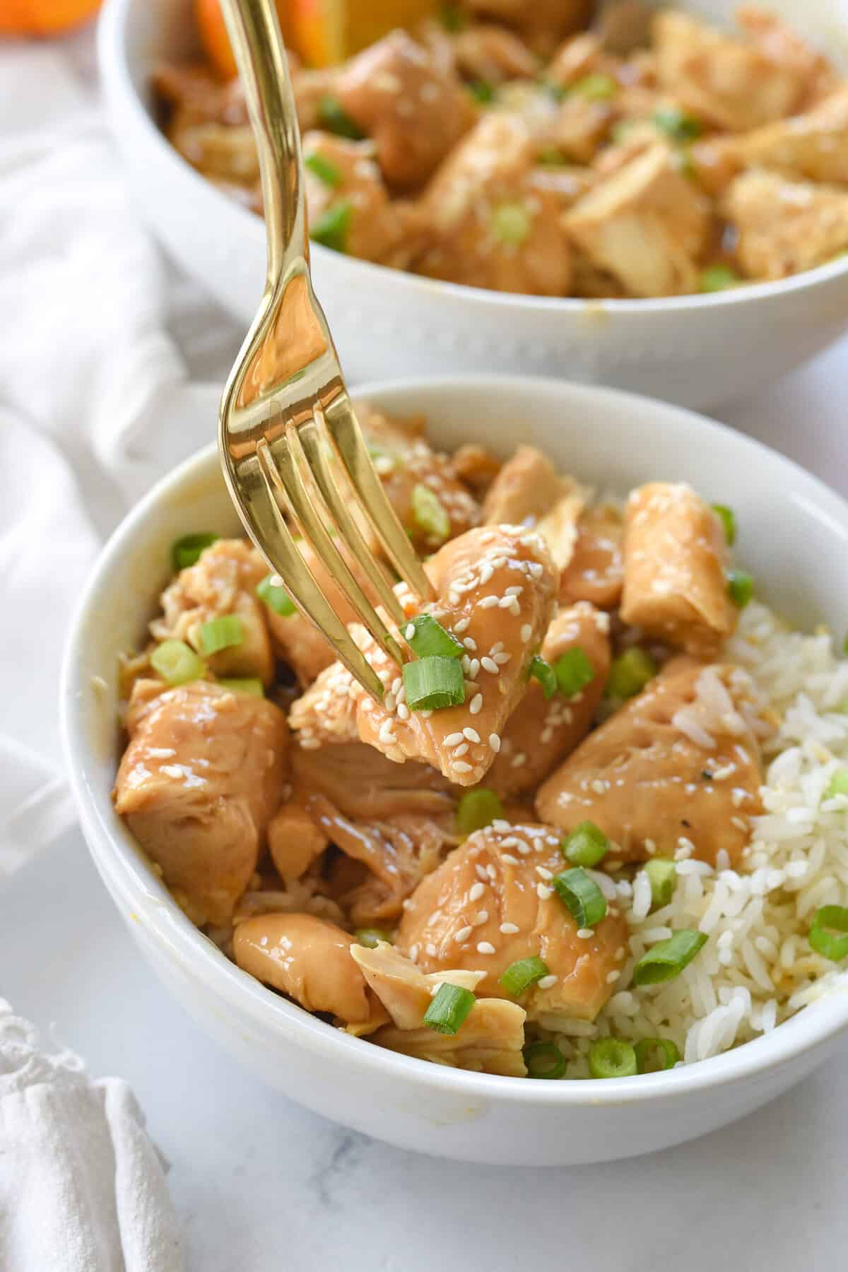fork full of orange chicken
