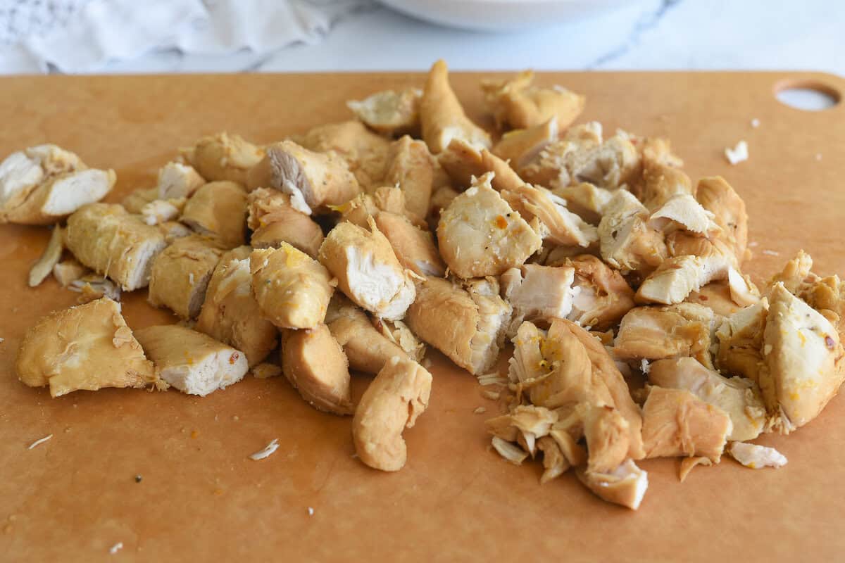 cutting up cooked chicken
