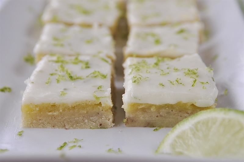 layered key lime bars on a serving tray