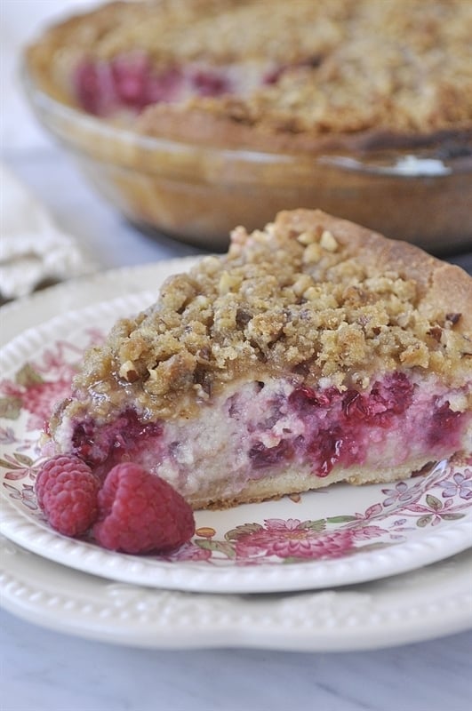 slice of raspberry sour cream pie on a plate