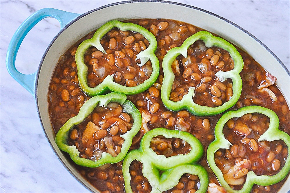 green pepper rings on top of baked beans