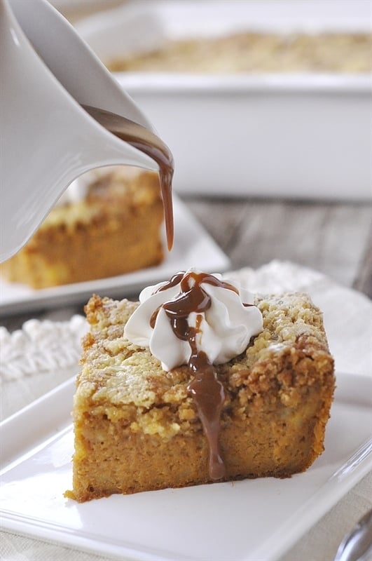 pouring caramel sauce over pumpkin cake