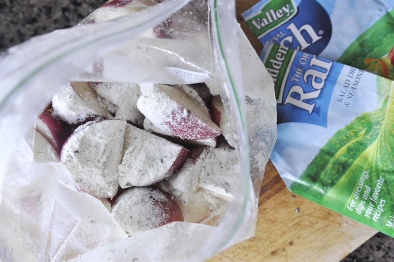 bag of potatoes tossed in dressing