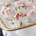 white chocolate oreo cookie balls with sprinkles on a plate