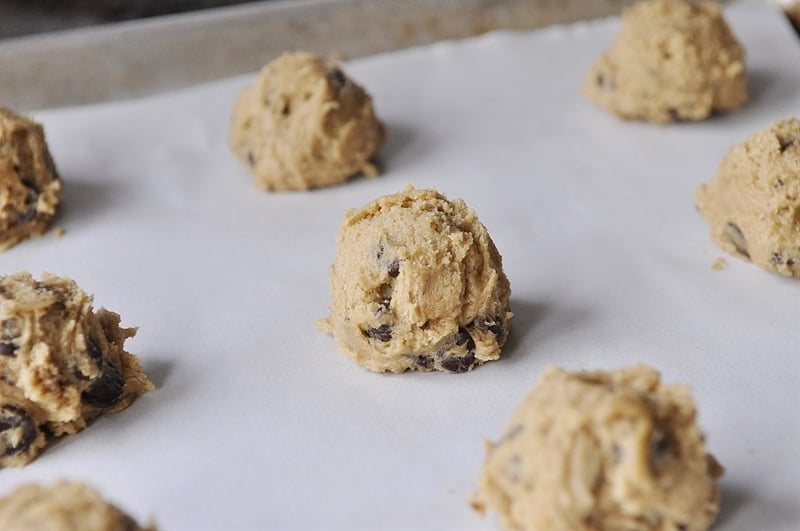chocolate chip cookie dough on a baking sheet