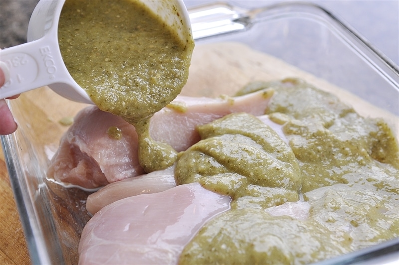 Covering chicken with Salsa Verde