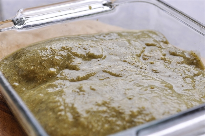 salsa verde chicken in a glass pan
