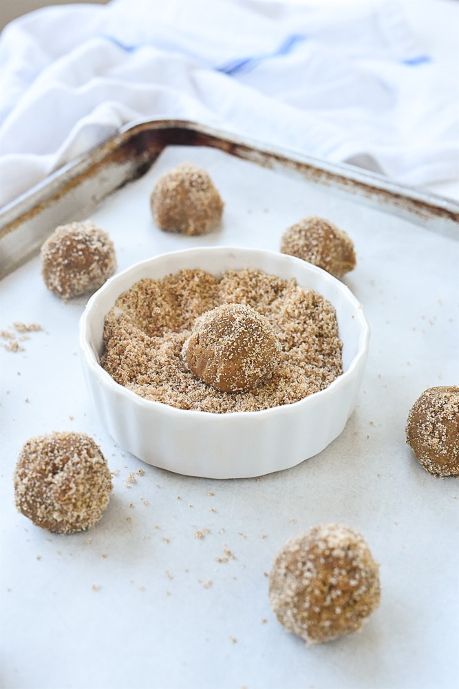 cookie dough in a bowl of sugar