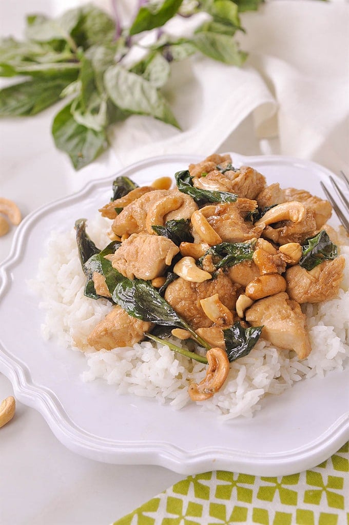 plate of rice with thai cashew chicken on top