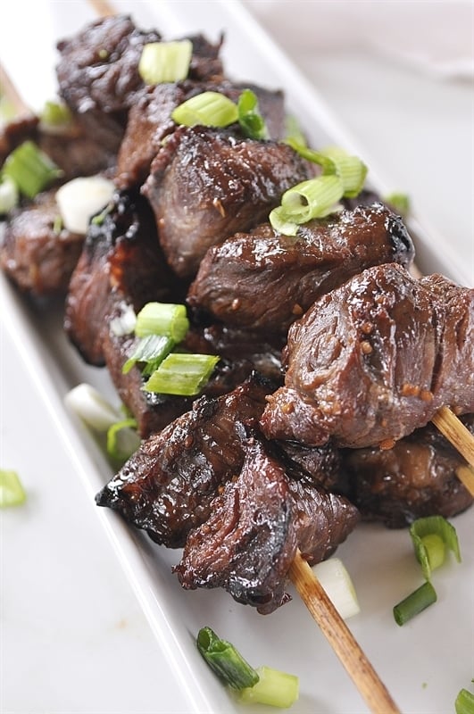 Teriyaki Beef Skewers on a white plate