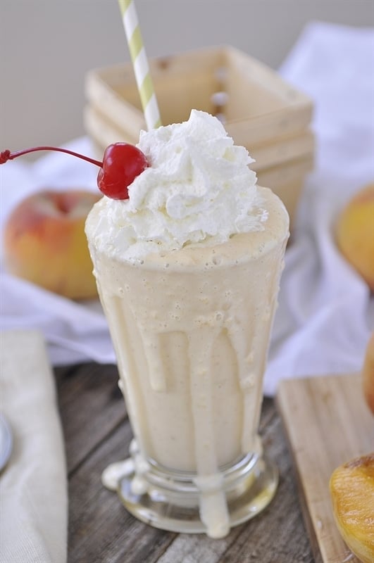 peach shake with whipped cream on top