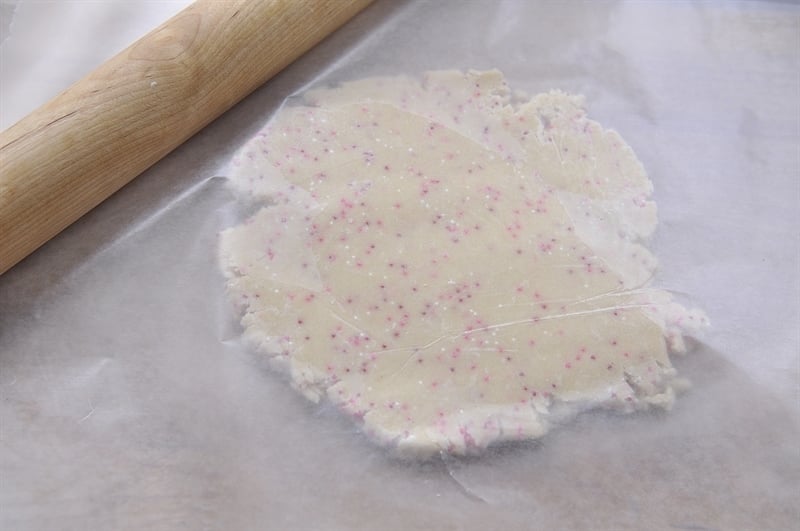 rolling out heart cookie dough