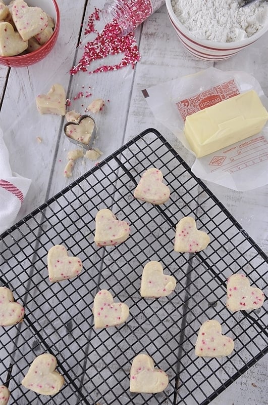 heart shaped shortbread cookies on a cooling rack