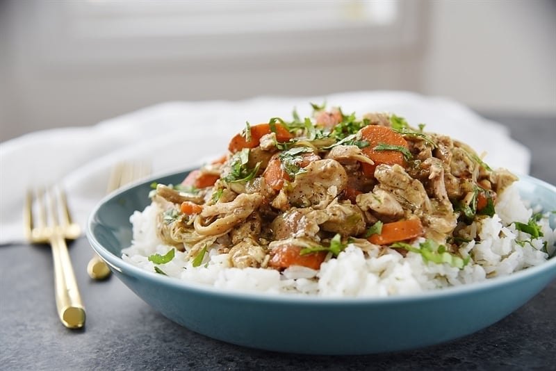 bowl of rice topped with slow cooker chicken curry