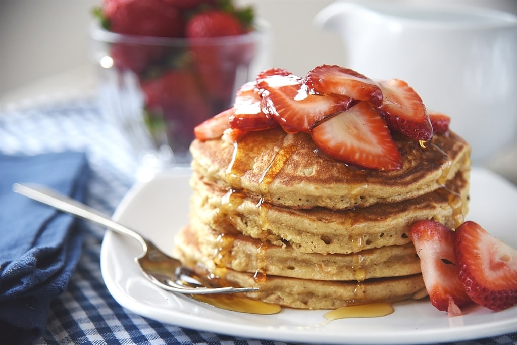 Brown Sugar Oatmeal Pancakes with strawberries and syrup