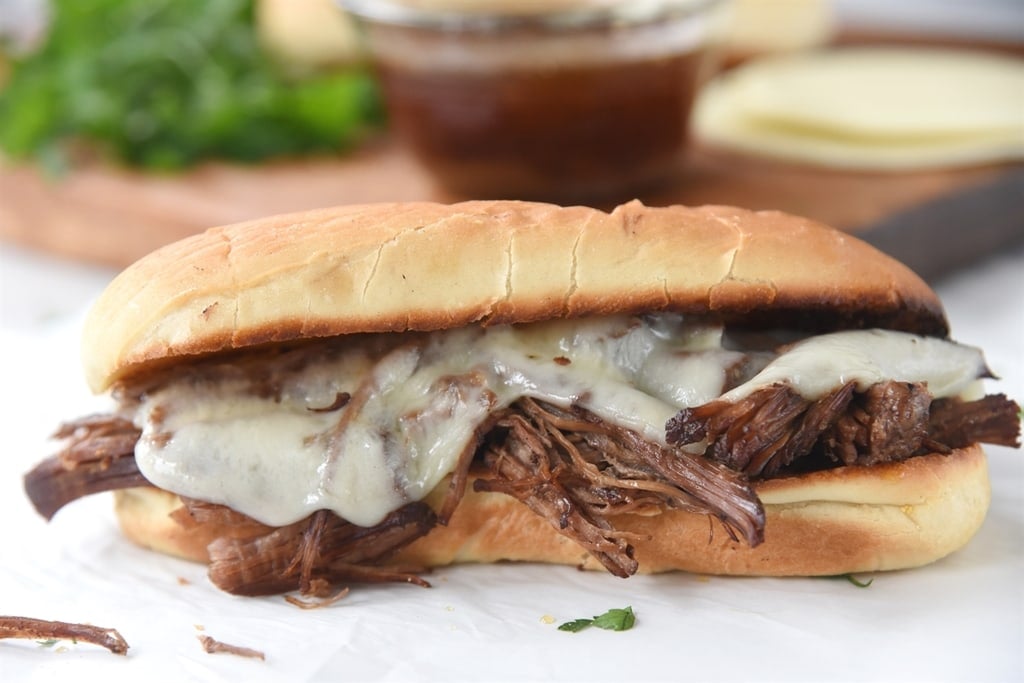 Instant Pot French Dip melted cheese on a toasted but