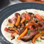 steak fajitas on a flour tortilla