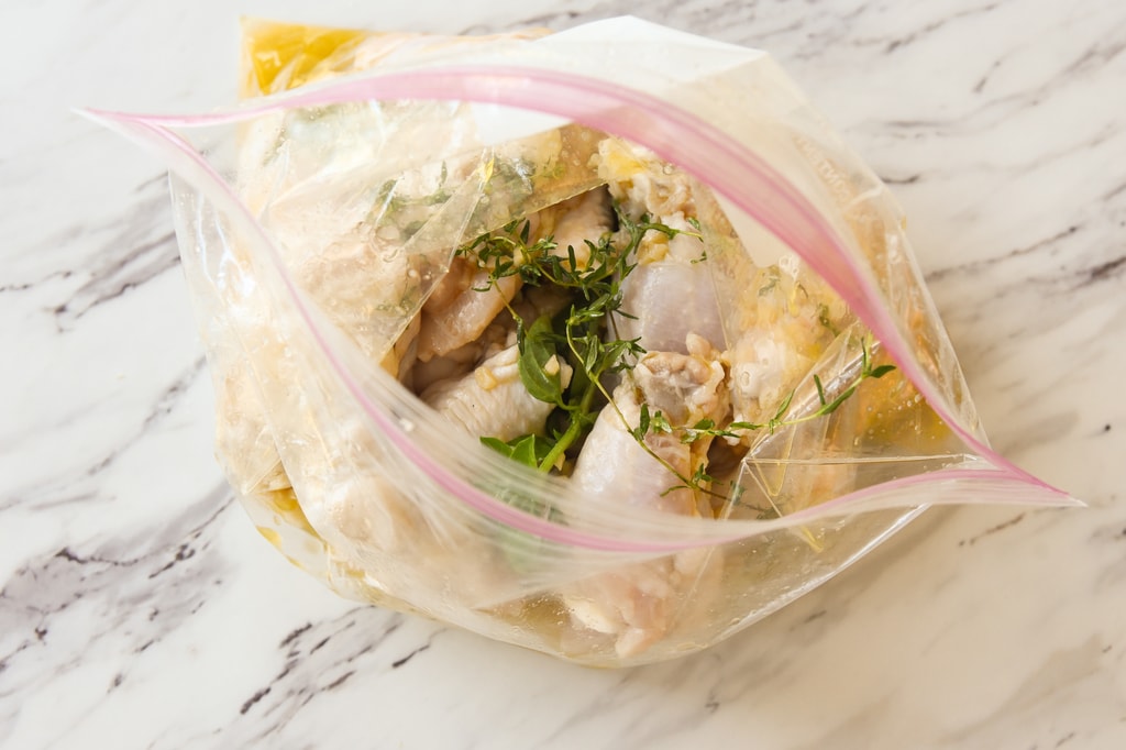 chicken marinading in a bag