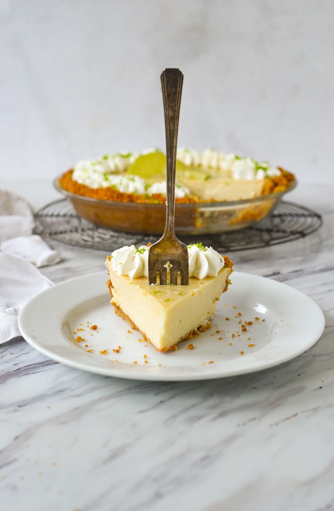 slice of key lime pie with a fork in it.