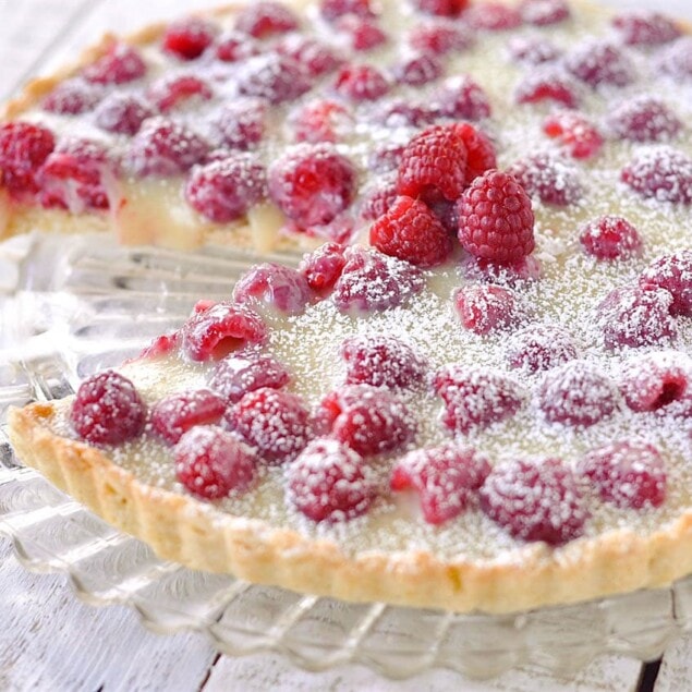 raspberry tart with piece missing