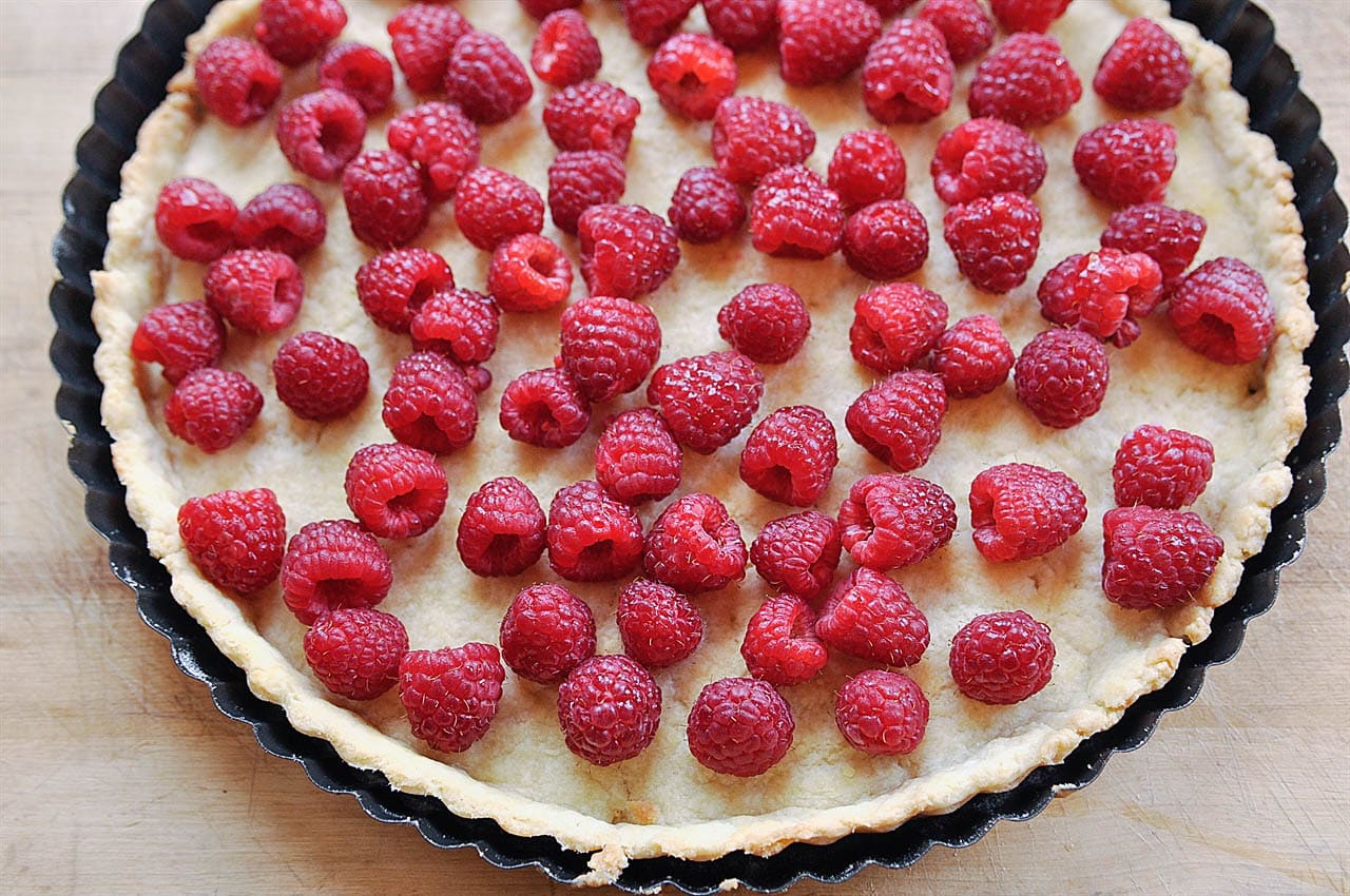 tart filled with raspberries