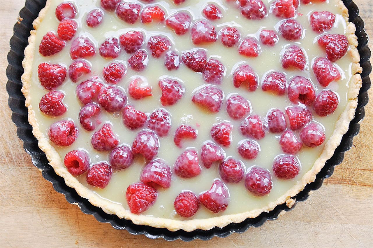 white chocolate over raspberries