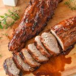 two chinese bbq pork loins on a cutting board